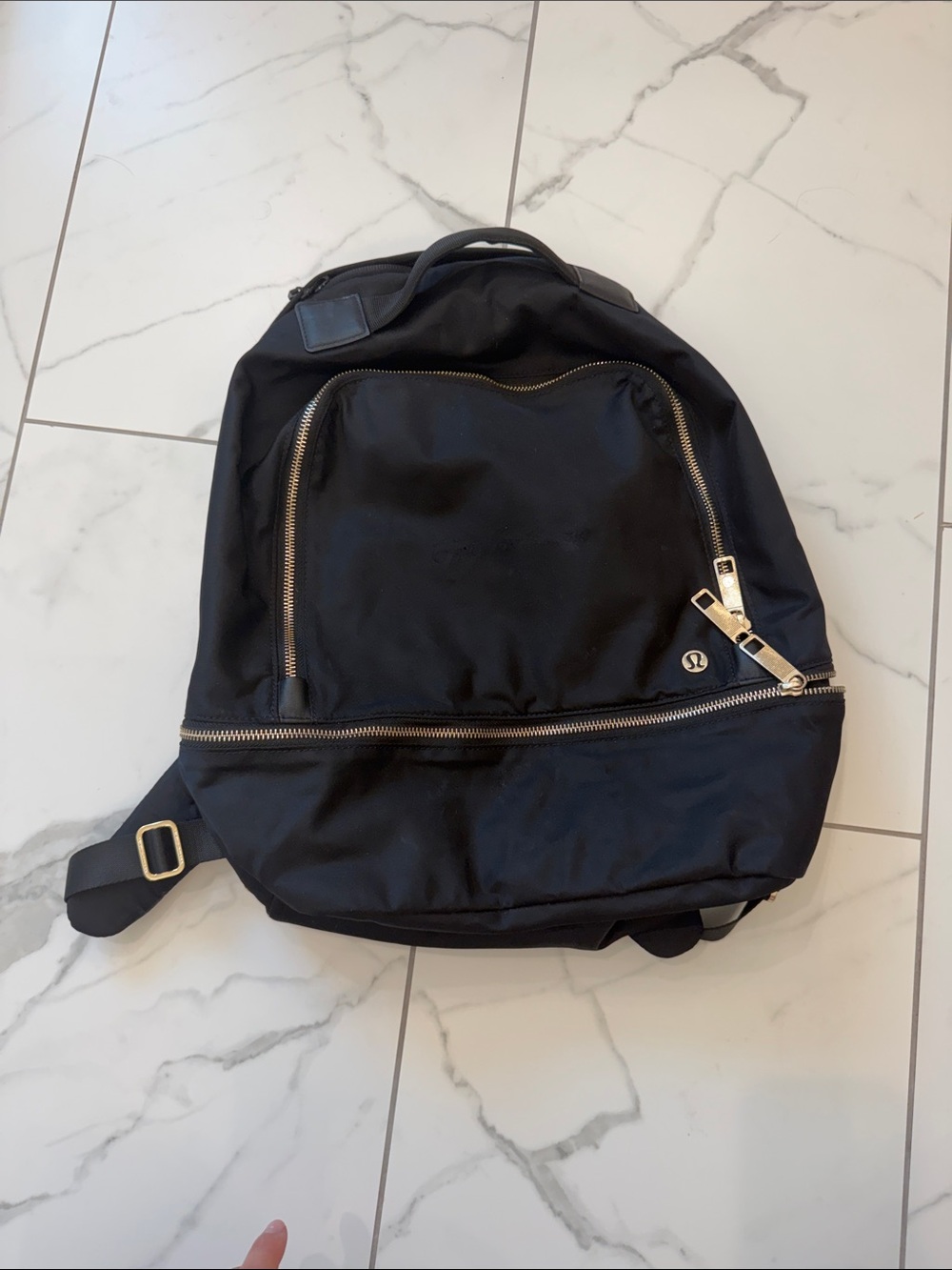Lululemon City Adventurer Backpack- spot on front where embroidery was removed